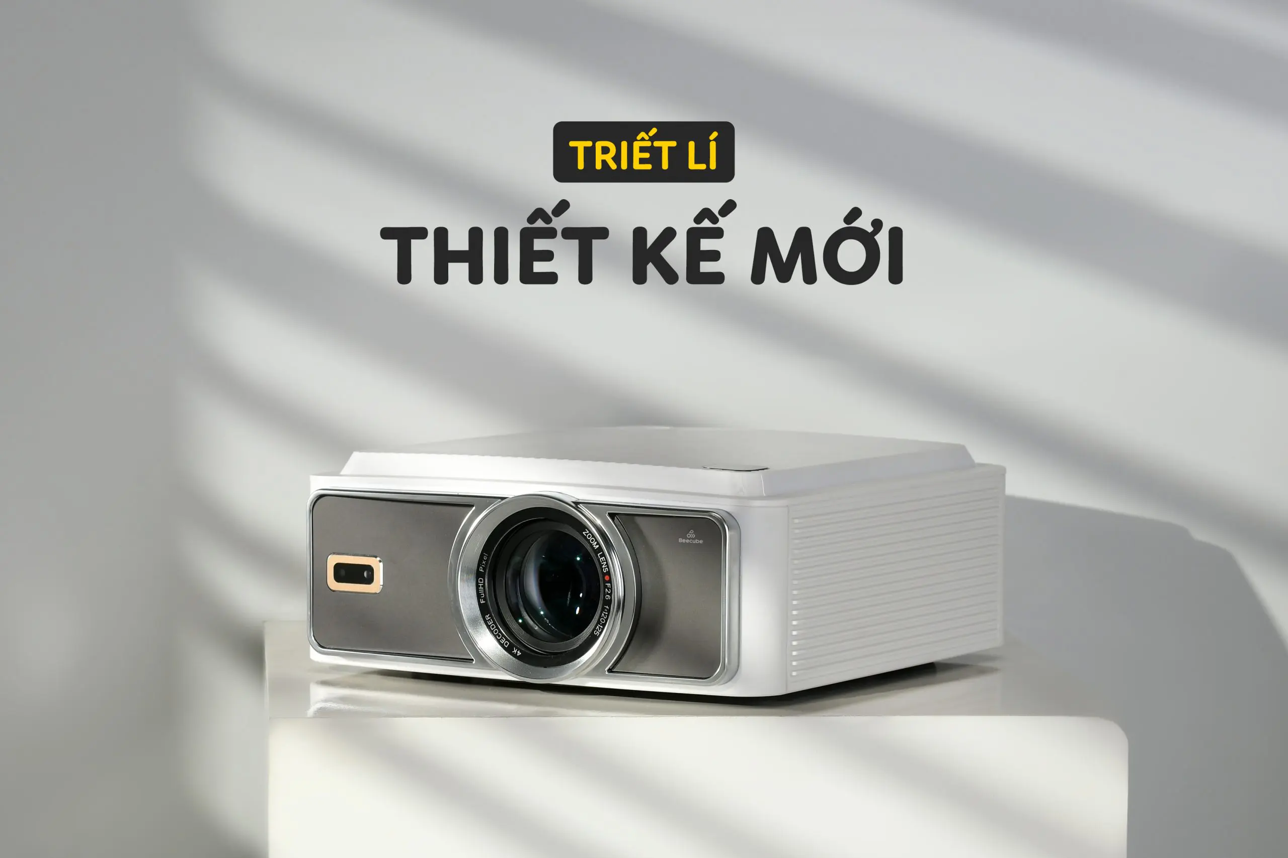 A white projector with a lens Description automatically generated